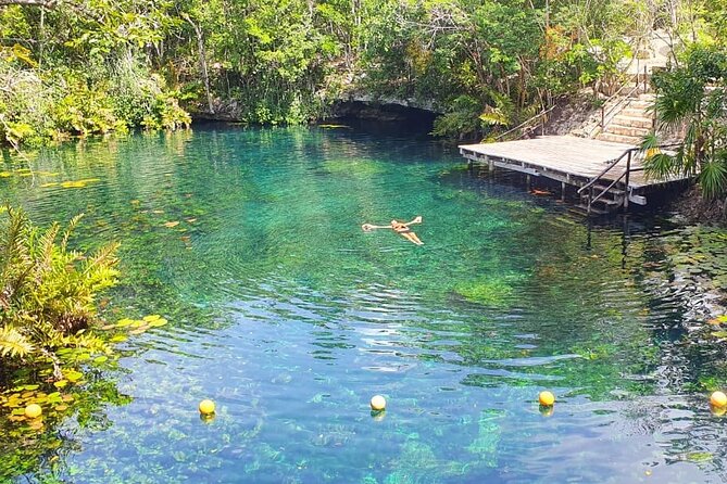4 Private Cenotes, Zip-Lines, Canoes & Mayan Village with Delicious Lunch - Canoes, cave swimming, and cliff jumps