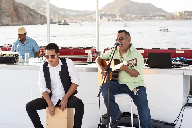 Cabo Sunset Dinner Cruise with Live Music & Open Bar on Cabo Wave - Lovers Beach as the sun goes down