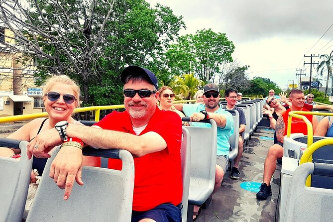 Cancun City Sightseeing and Shopping Tour on a Double Decker bus - Playa Delfines and the Cancun sign