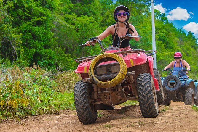 Cancun Combo Tour: ATV and Zip- lines with Cenote Swim - ATV riding on a dusty, rough track