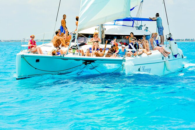 Catamaran to Isla Mujeres Snorkeling Tour with Open Bar and Lunch - The snorkeling stop: beautiful water, short swim