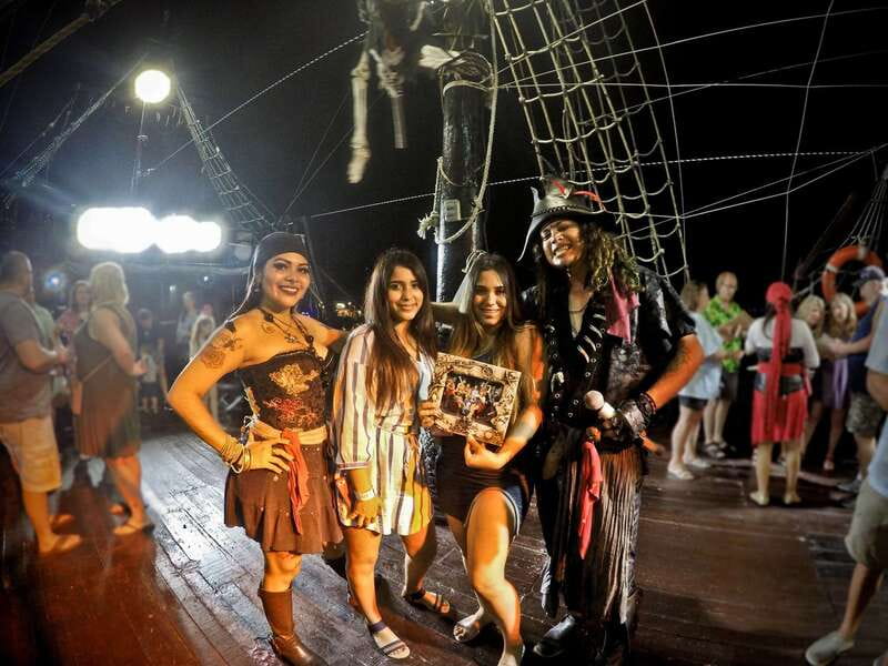 Cozumel: Pirate Ship Cruise with Open Bar, Dinner, and Show - Boarding a pirate galleon at sunset