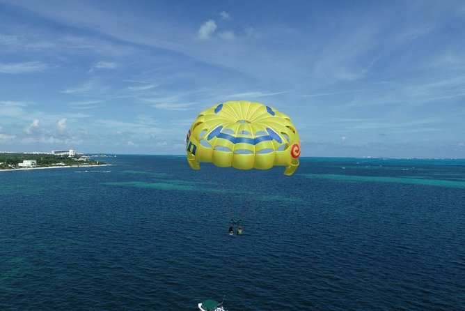 Fly Above Cancun Bay: Parasailing Experience - Safety briefing, harness, and the boat launch