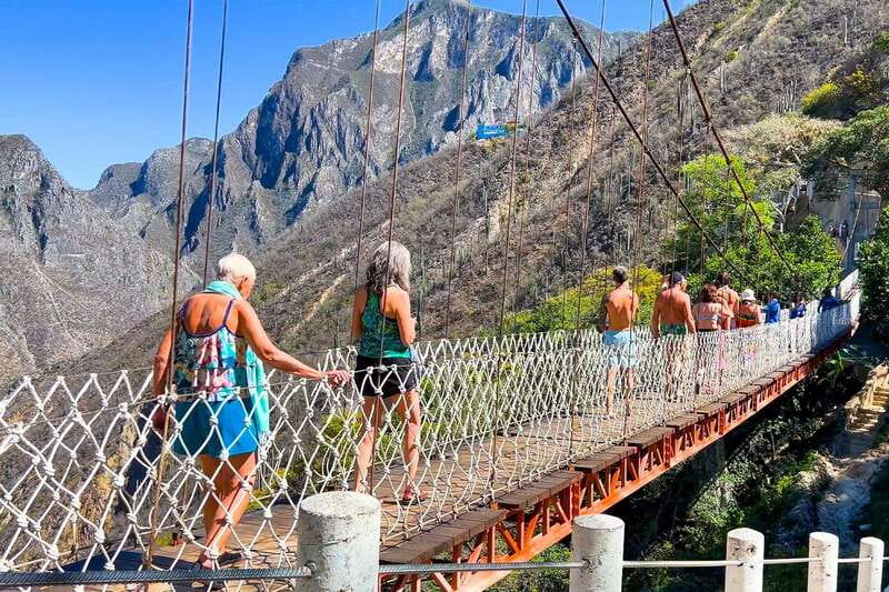 From Mexico City: Tolantongo Hot Springs Day Trip with Guide - River water, trails, and the suspension bridge