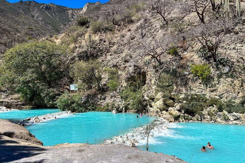 From Mexico City: Tolantongo Hot Springs Day Trip with Guide - What to pack for a wet mountain day