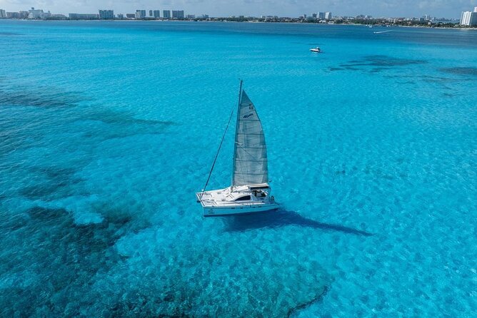 Isla Mujeres Day Tour with Catamaran, Snorkeling & Beach Club - Setting sail from Marina Las Perlas