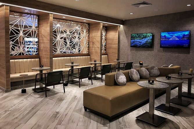 Mera VIP Lounge at Cancun International Airport - Seating, bathrooms, and comfort inside the room