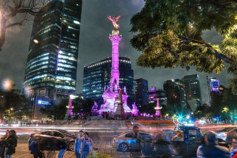 Mexico City: Night City Tour in a Double Decker Bus - Monumento a la Revolución adds scale and drama