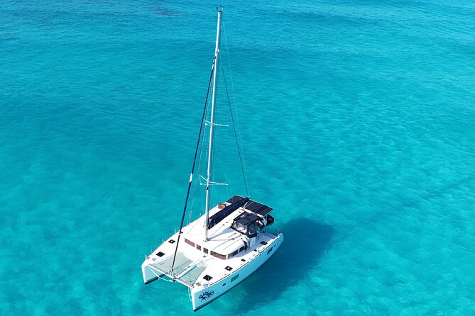 Private Catamaran Tour to Isla Mujeres - Sailing Out With Drinks and Safety Instructions