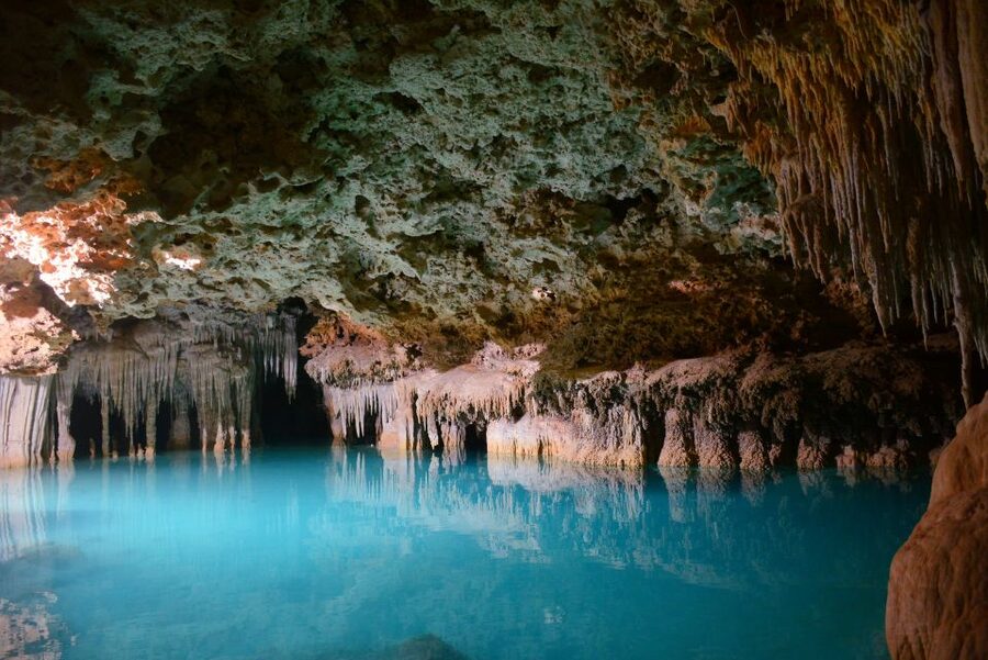 Rio Secreto Nature Reserve: Bicycle, Rappel & Ziplines Tour - Entering Xibalbá beside the underground river