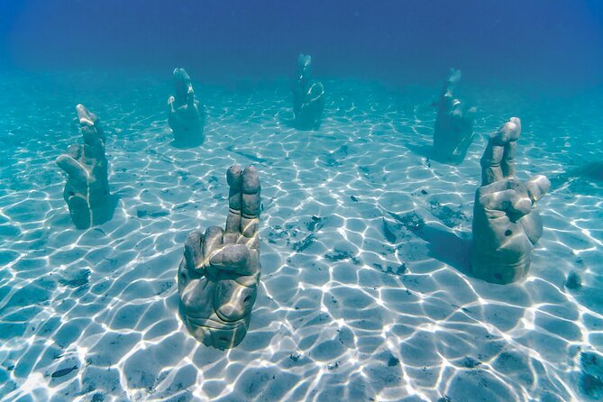 Top Isla Mujeres Catamaran Tour with Snorkel Open Bar and Buffet lunch - El Meco Reef: a short but enjoyable water stop