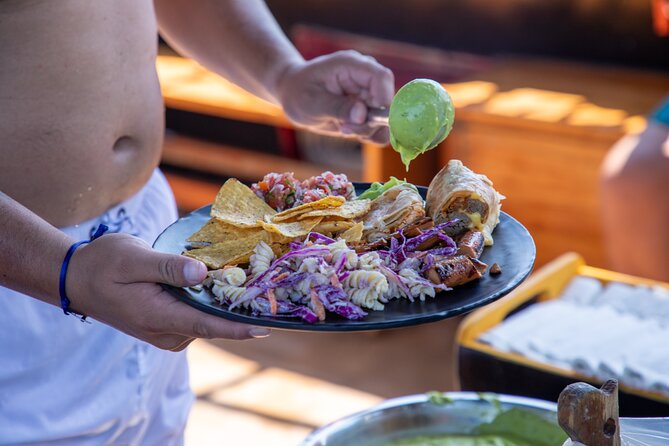 Treasure Hunt Snorkeling Lunch Cruise from Cabo San Lucas - Open bar, music, and games keep the deck moving